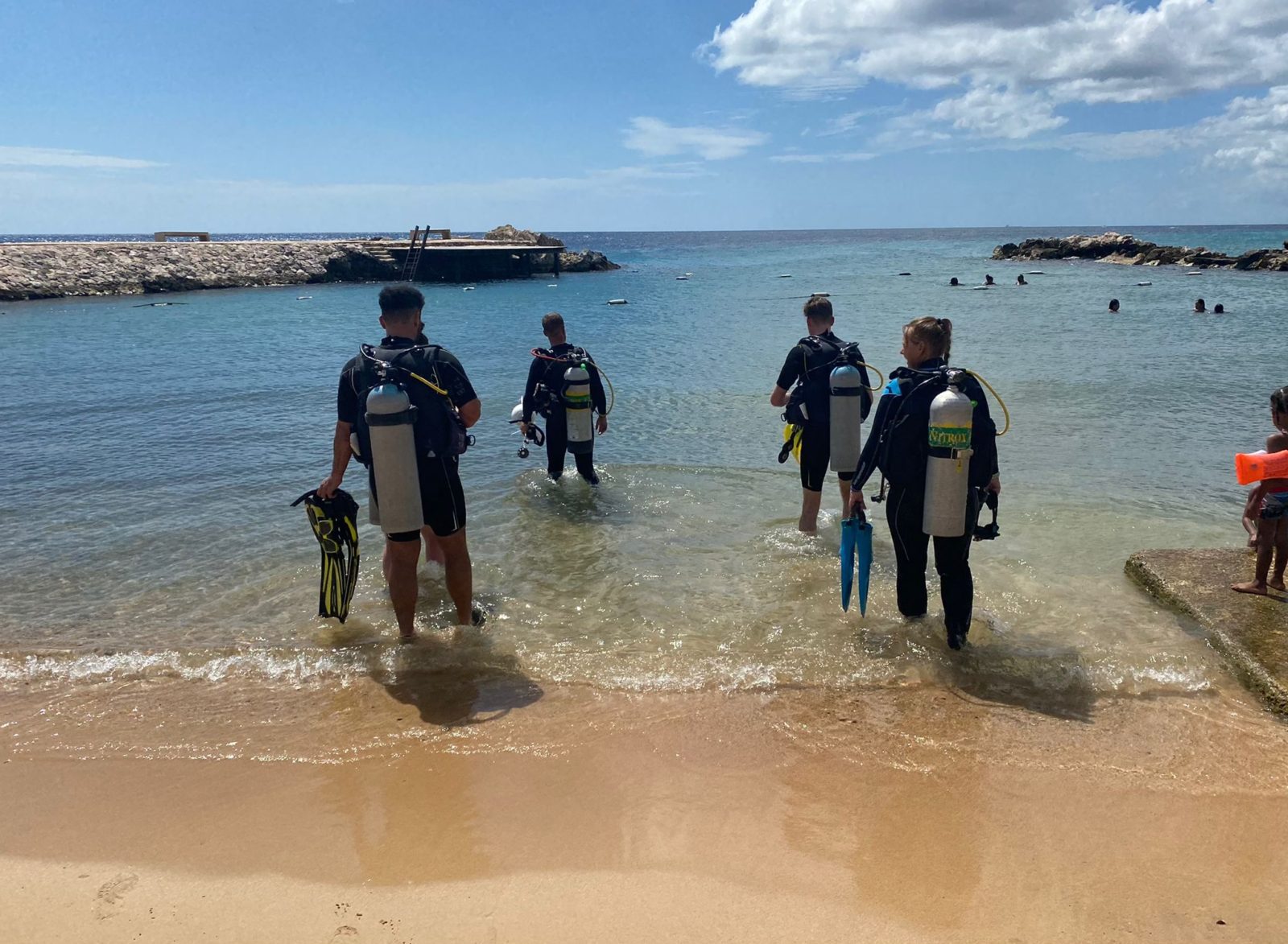 divers entering the water